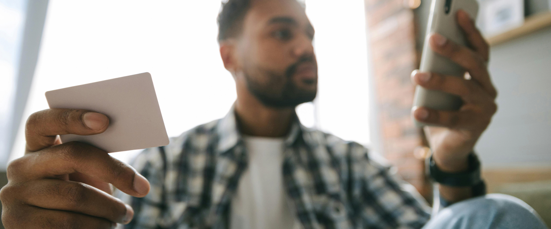 Person holding credit cards